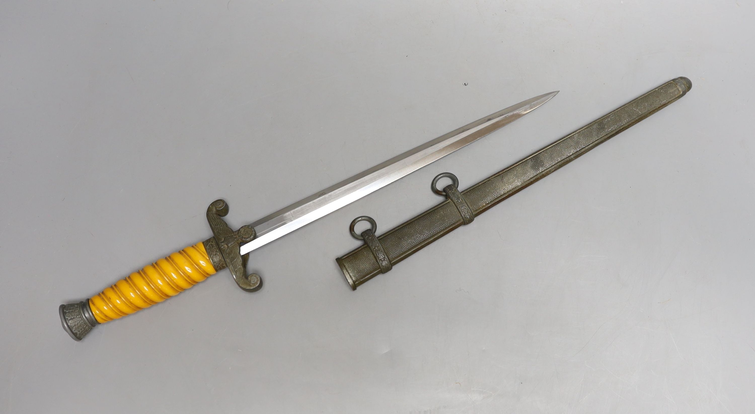 A WWII Third Reich army officer's dress dagger (chip to handle), 40 cms long.